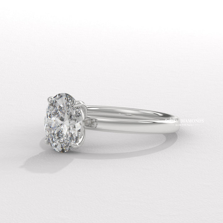 Oval solitaire lab grown diamond ring fitted on finger