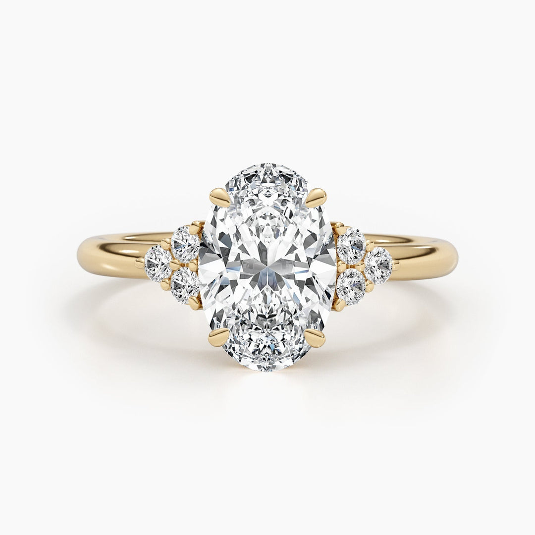 Close-up of oval cut center diamond in cluster engagement ring
