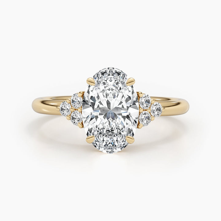 Close-up of oval cut center diamond in cluster engagement ring