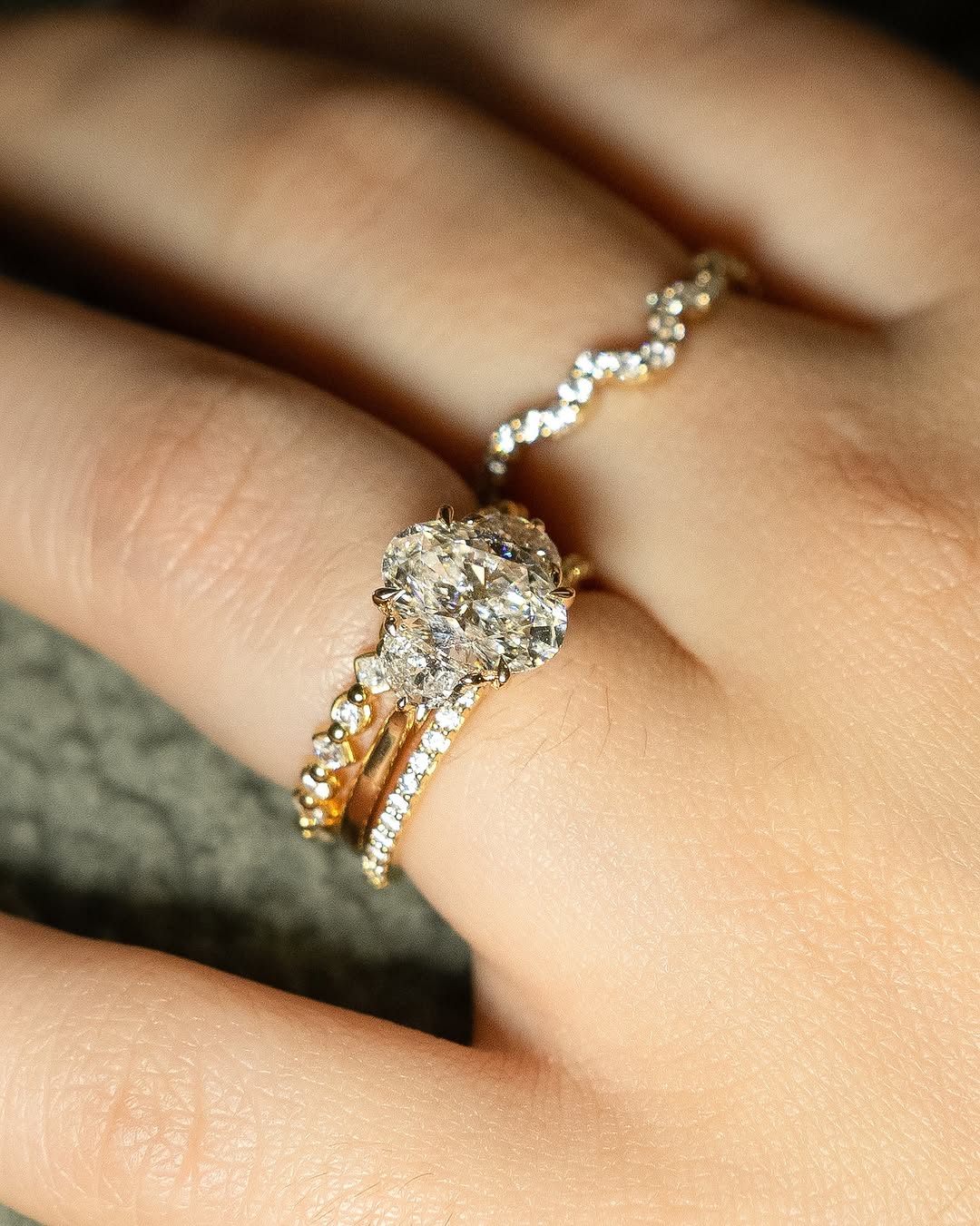 Premium oval cut three stone engagement ring crafted in solid gold