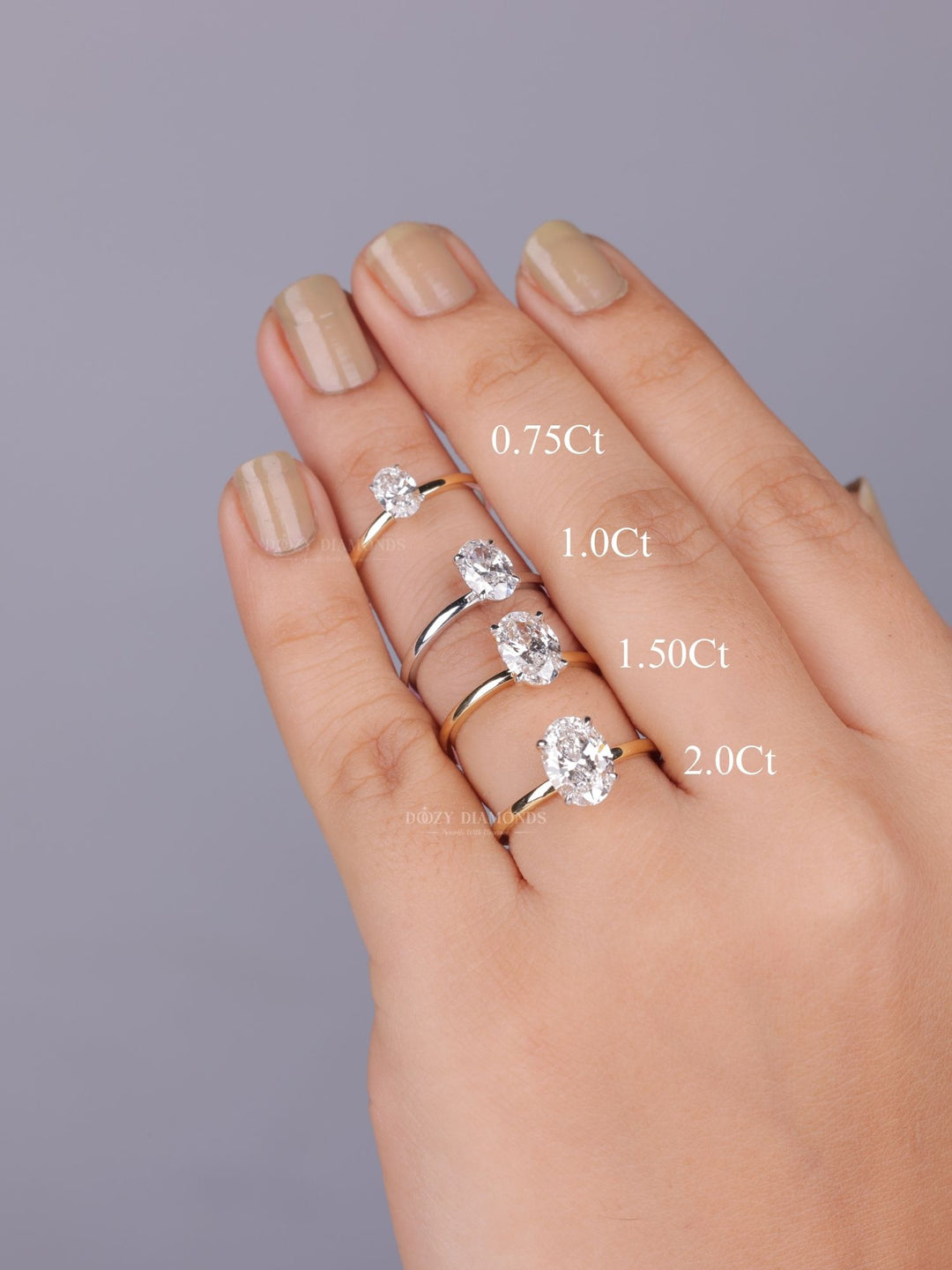 Oval solitaire diamond engagement ring available in multiple metals
