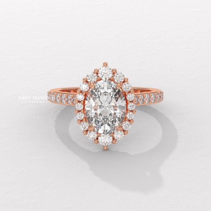 Oval cut diamond ring worn on hand