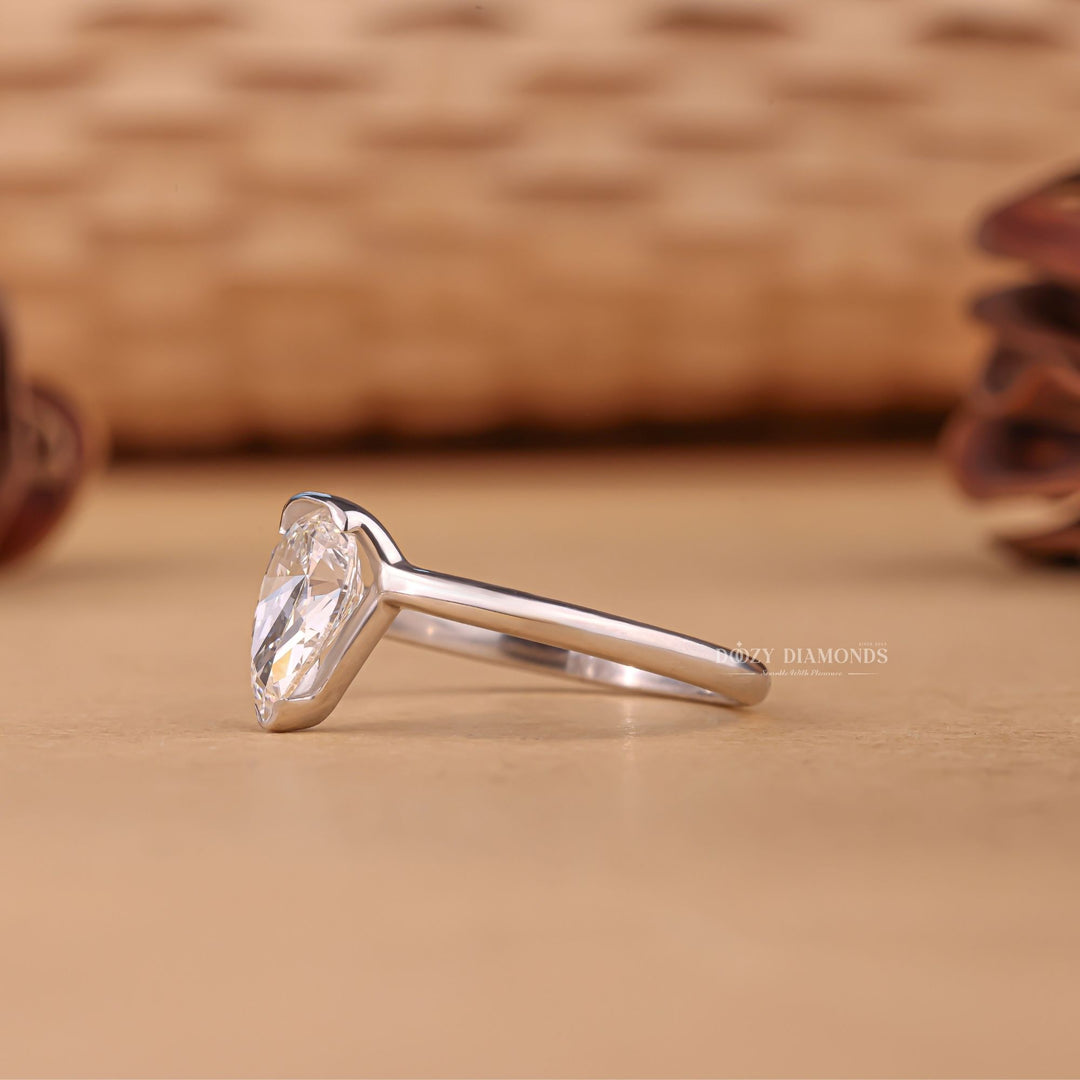 Pear solitaire engagement ring offered in gold and platinum