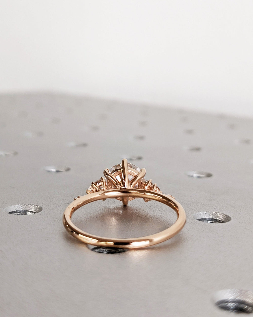 Side angle of round cluster diamond engagement ring