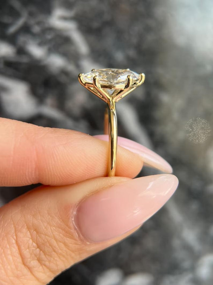 Fine craftsmanship detail on marquise solitaire engagement ring