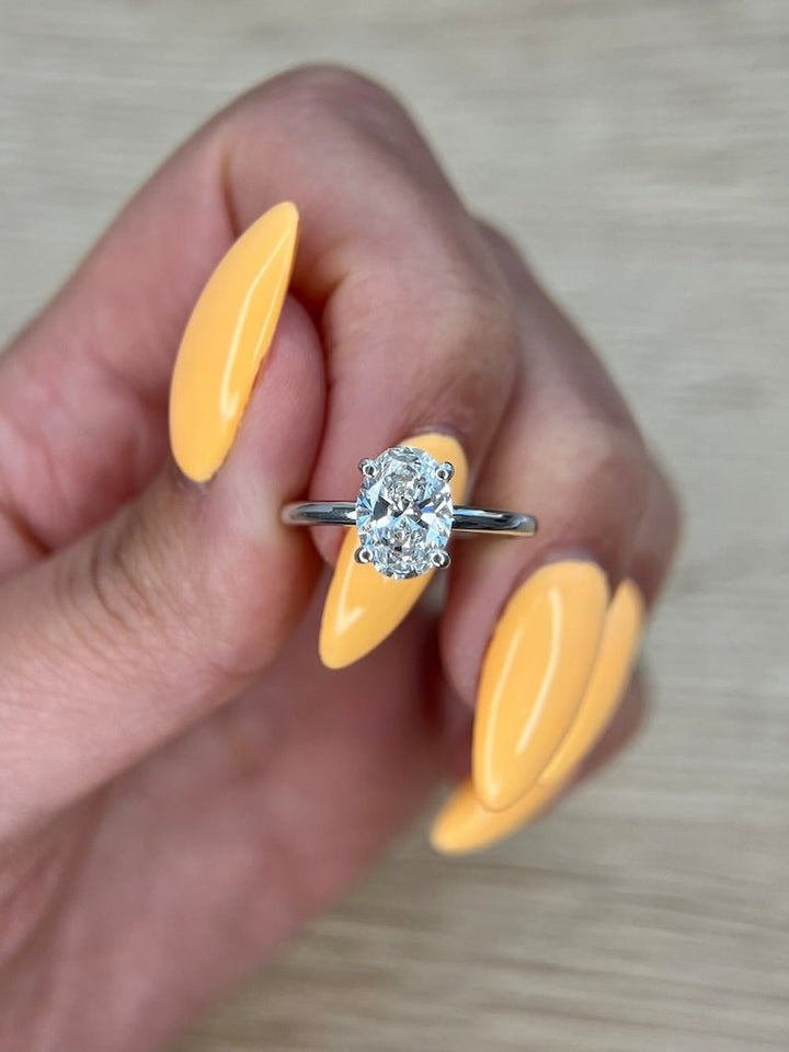 Shop the oval cut hidden halo engagement ring collection online