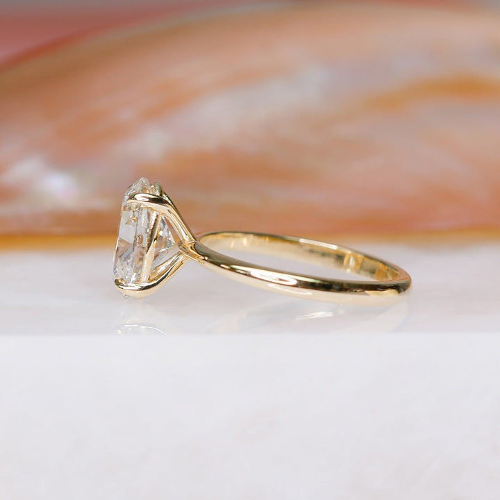 Oval cut solitaire engagement ring shown in real-life wear