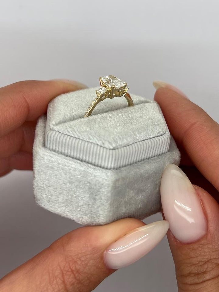 Radiant three stone ring set with an IGI graded diamond