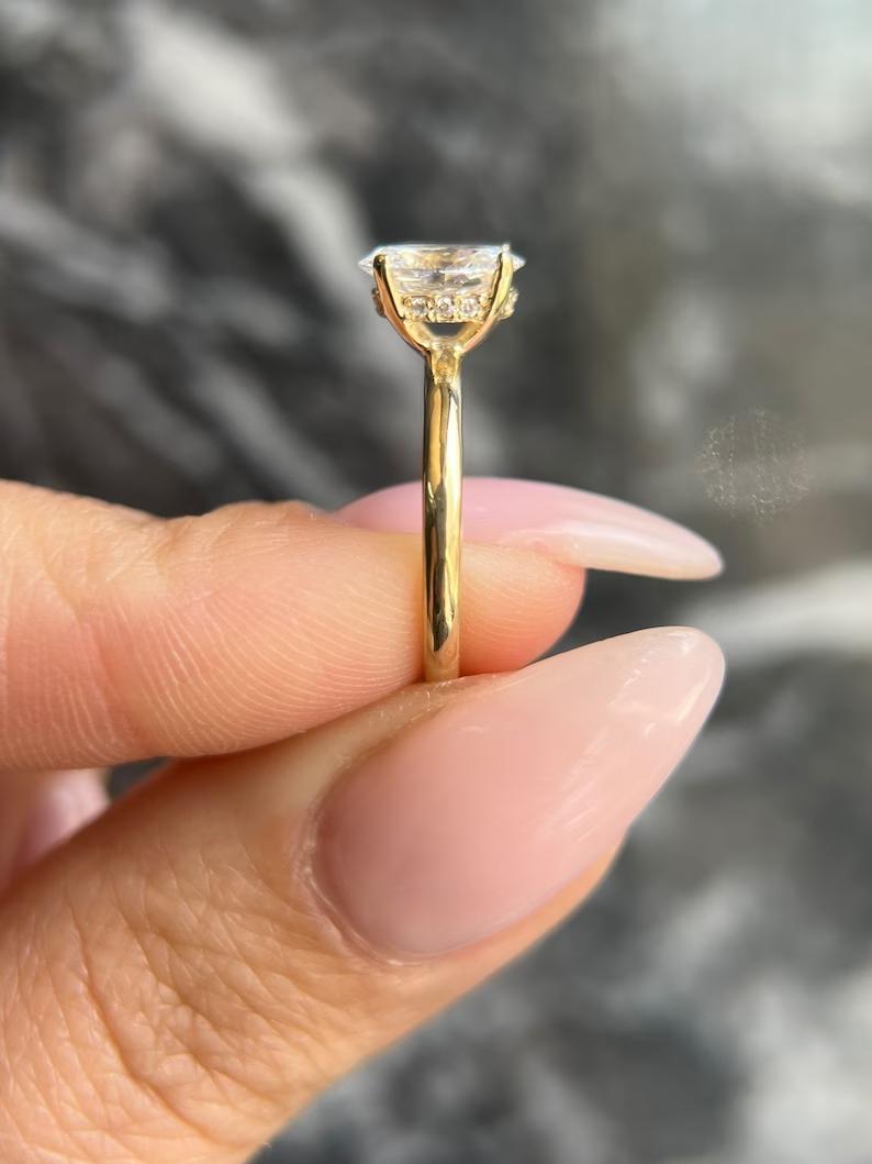 Oval hidden halo engagement ring with IGI certificate and packaging