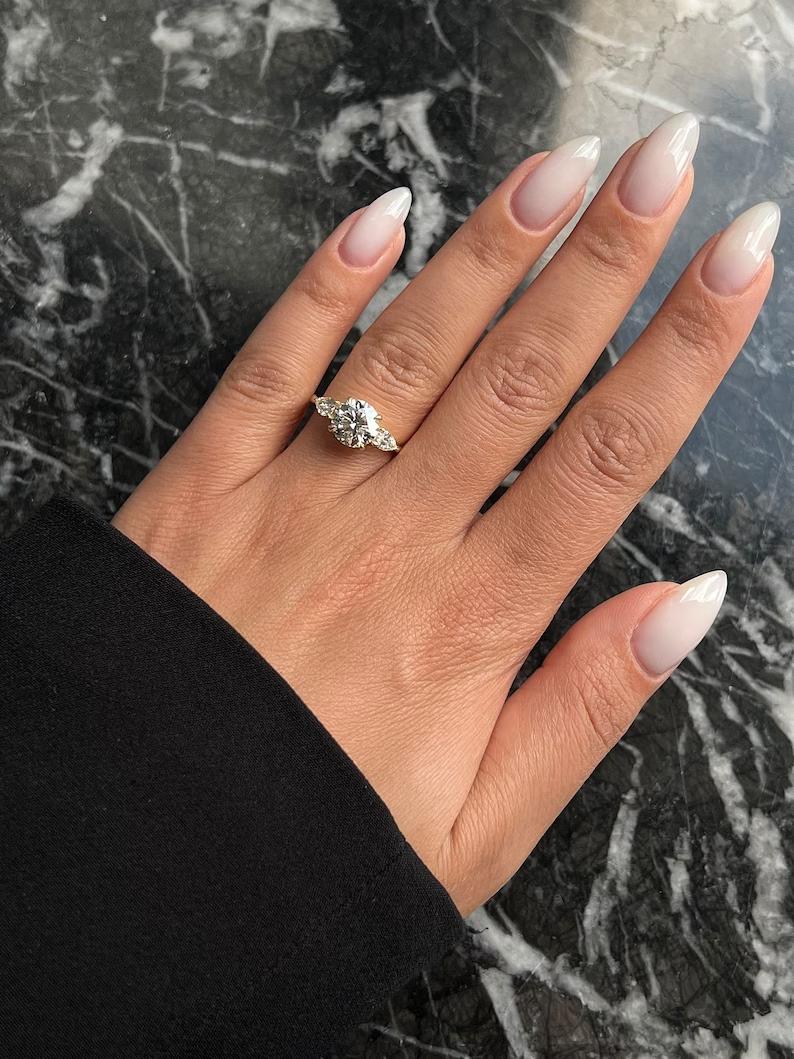 Discover round three stone lab grown diamond engagement ring online