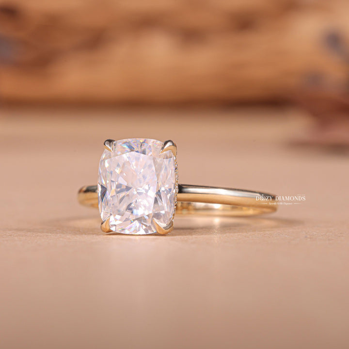 Side angle of cushion hidden halo diamond engagement ring