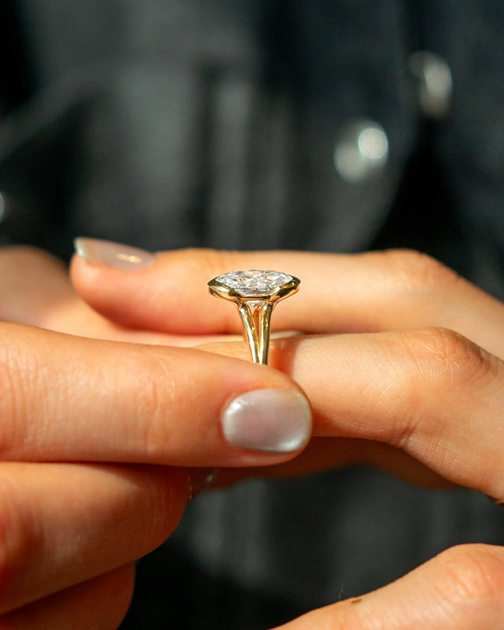 Fine craftsmanship detail on oval bezel engagement ring