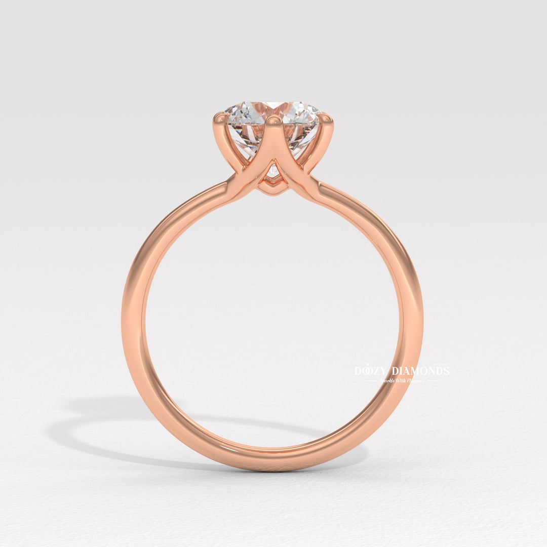 Round solitaire engagement ring photographed in natural light