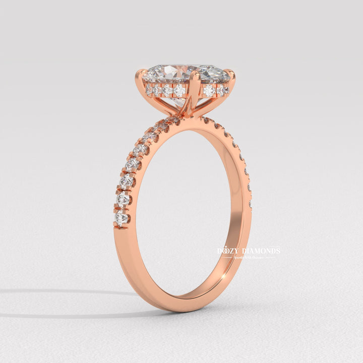 Side angle of oval hidden halo diamond engagement ring