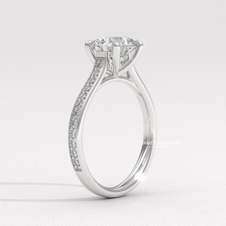 Angled view of round cut diamond in pave setting