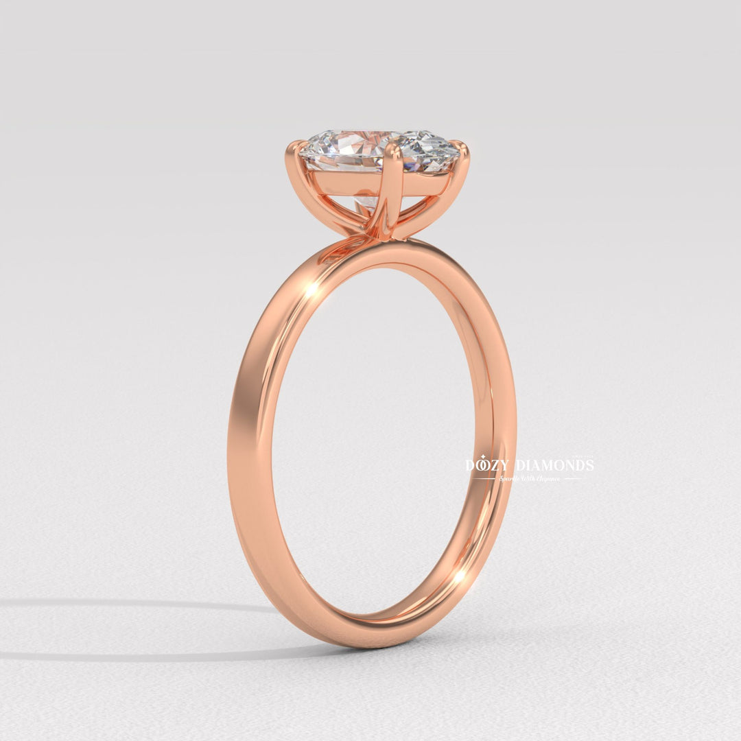 Lifestyle shot of oval solitaire diamond ring on hand