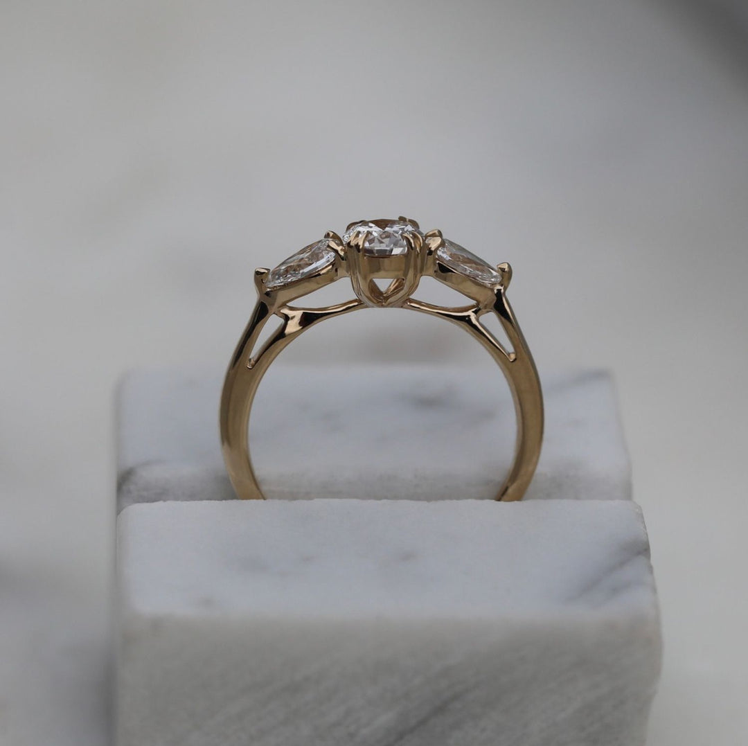 Round solitaire engagement ring shown on hand for true-to-life sizing
