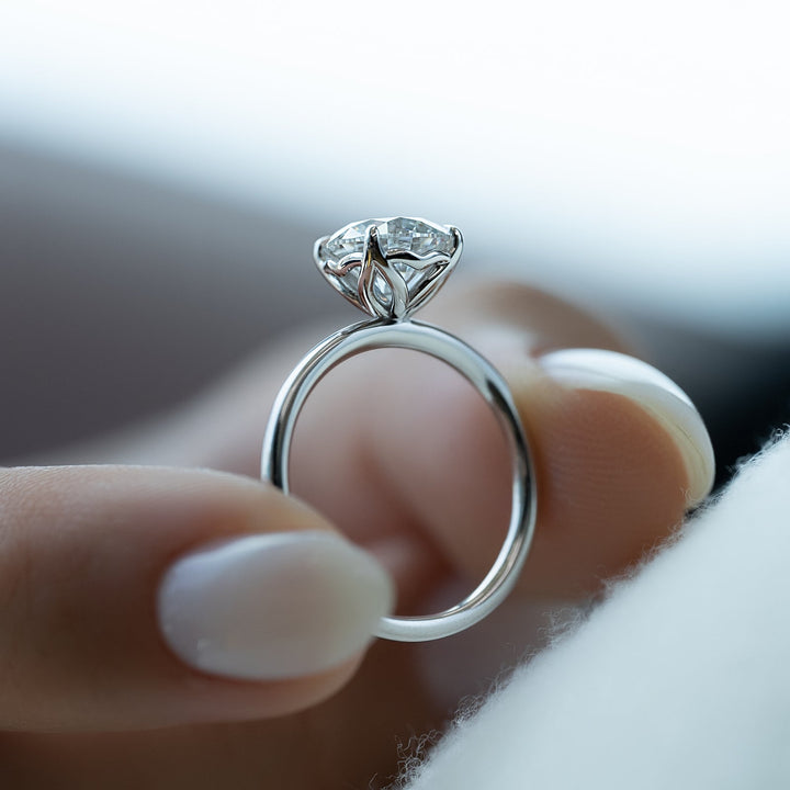 Round solitaire engagement ring with IGI certificate and packaging