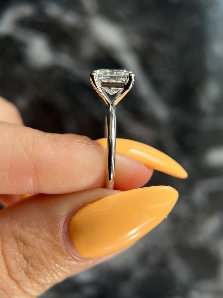 Princess solitaire engagement ring close-up highlighting diamond sparkle