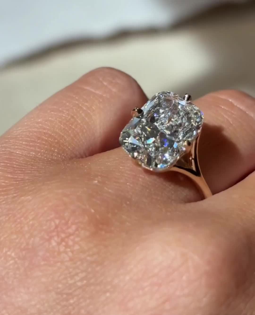 Cushion split shank engagement ring close-up showing high clarity diamond clarity