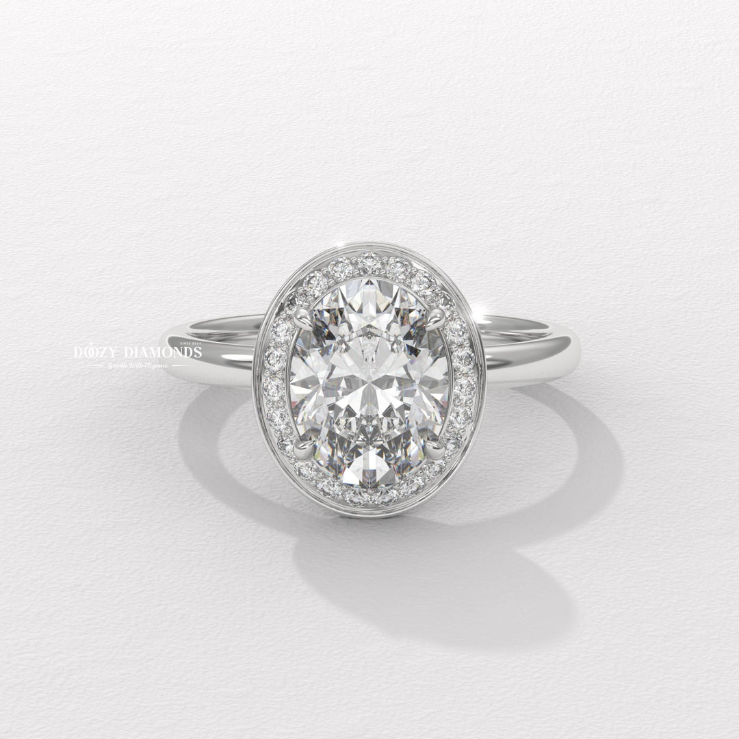 Oval halo engagement ring offered in gold and platinum