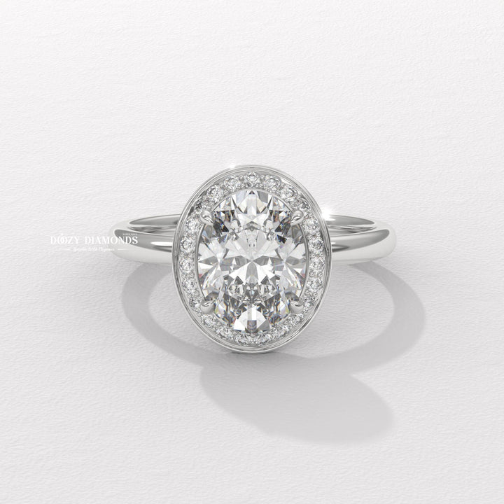 Oval halo engagement ring offered in gold and platinum