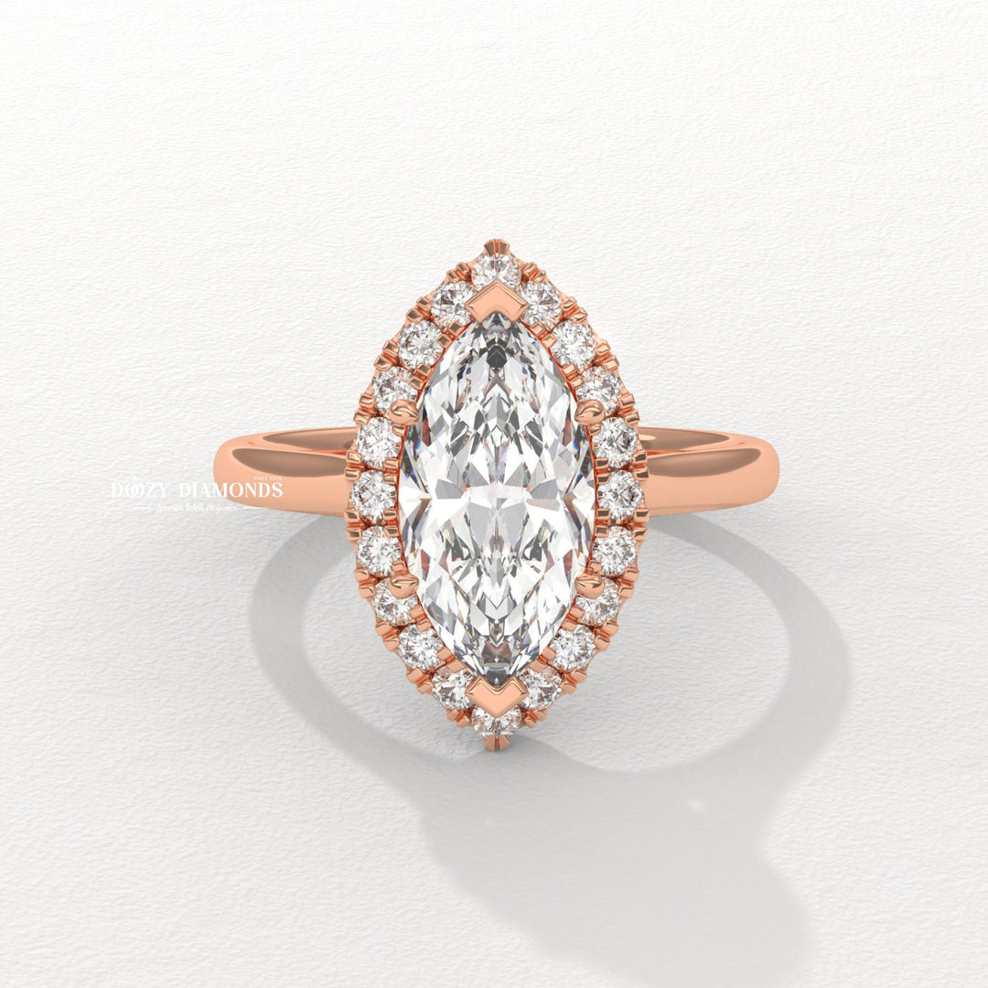 Macro shot of marquise cut diamond facets in halo ring setting