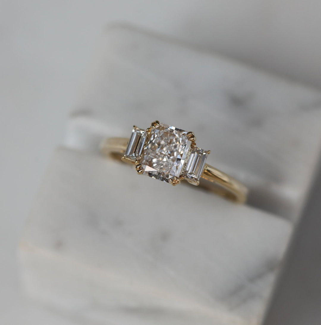 Radiant solitaire diamond engagement ring available in multiple metals