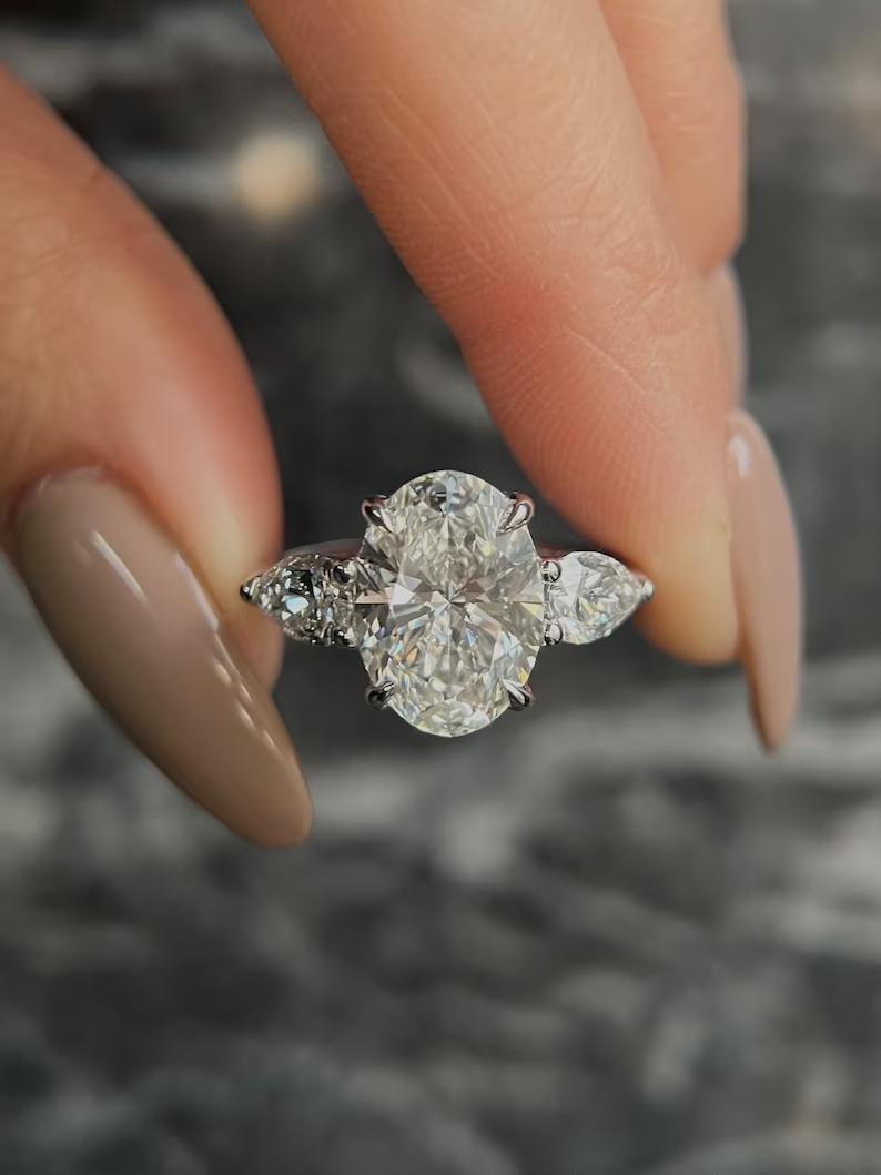 Discover oval three stone lab grown diamond engagement ring online