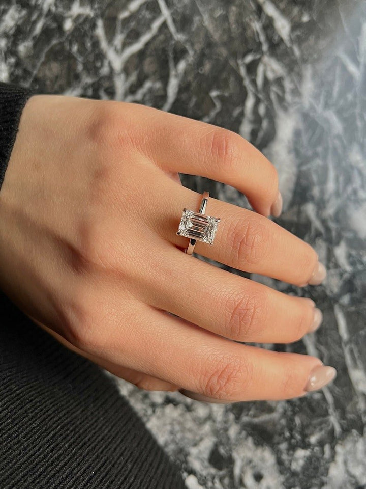 Emerald cut engagement ring side view showing band detail