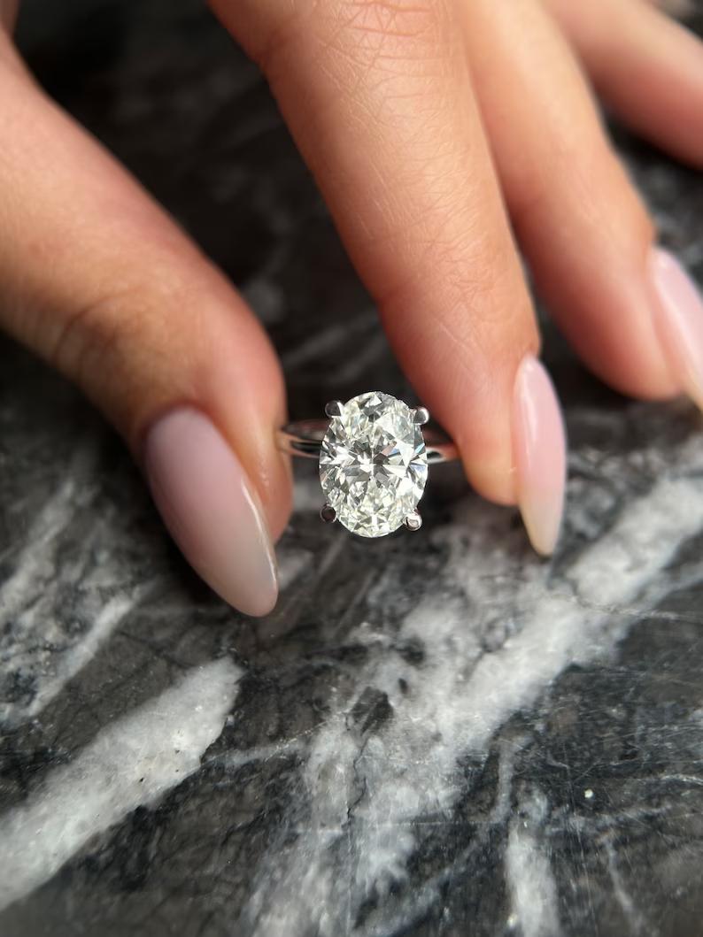 Shop oval hidden halo lab grown diamond engagement ring