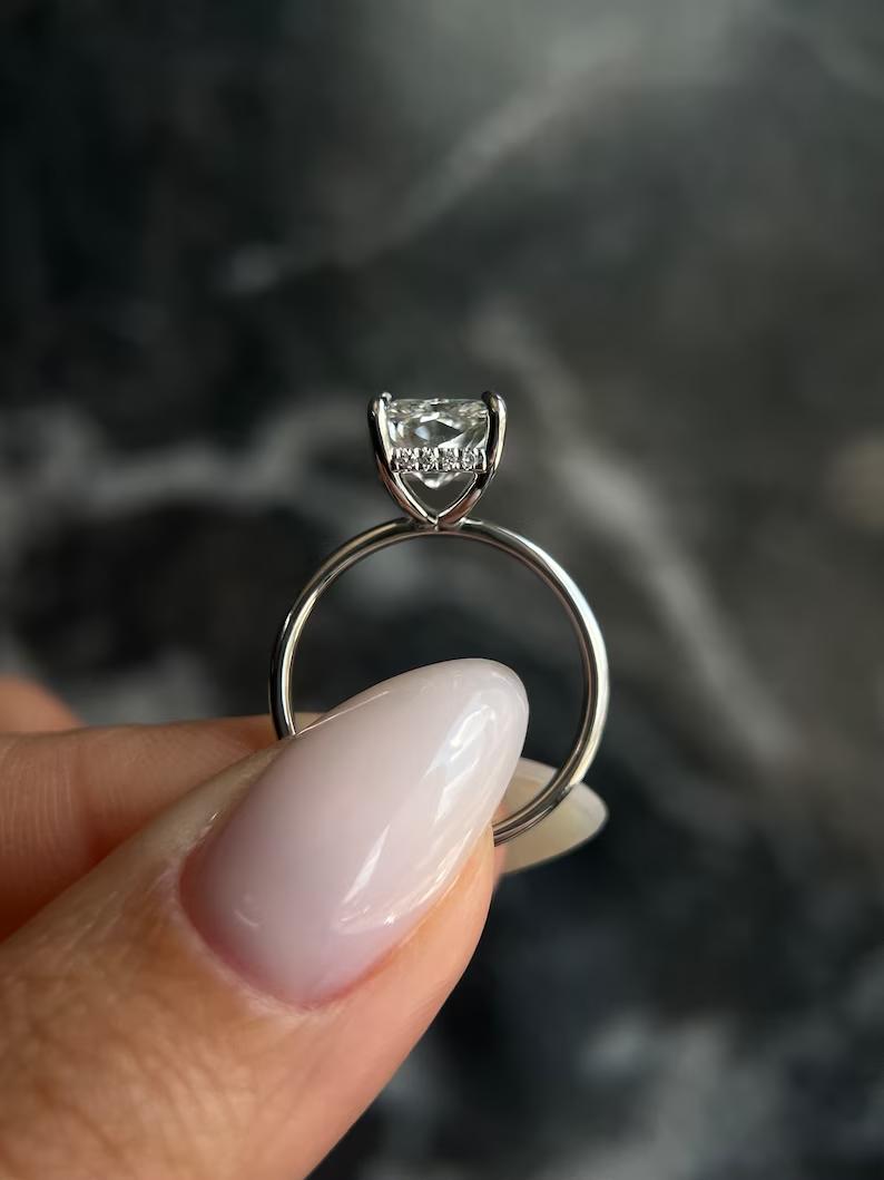 Radiant cut hidden halo engagement ring with IGI certified center diamond