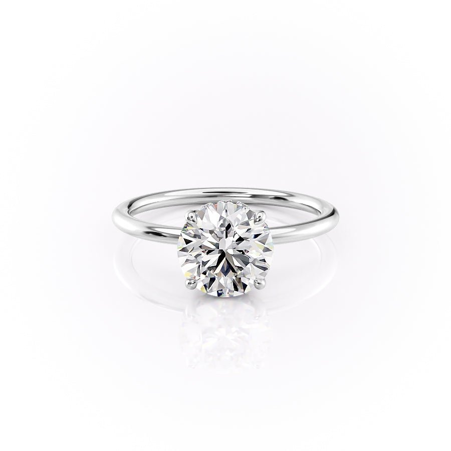 Lifestyle shot of round hidden halo diamond ring on hand
