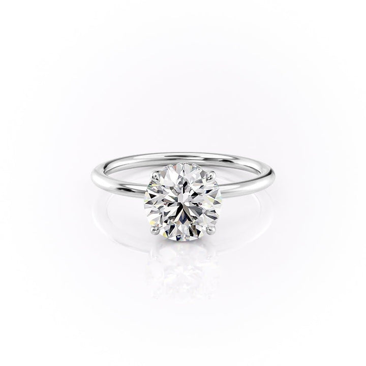 Lifestyle shot of round hidden halo diamond ring on hand