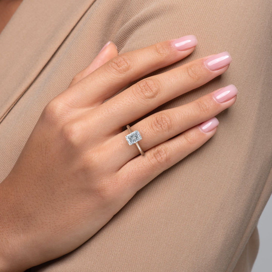Close-up of radiant cut center diamond in solitaire engagement ring