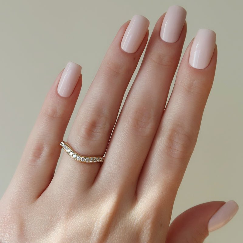 Round diamond band stacked with engagement ring
