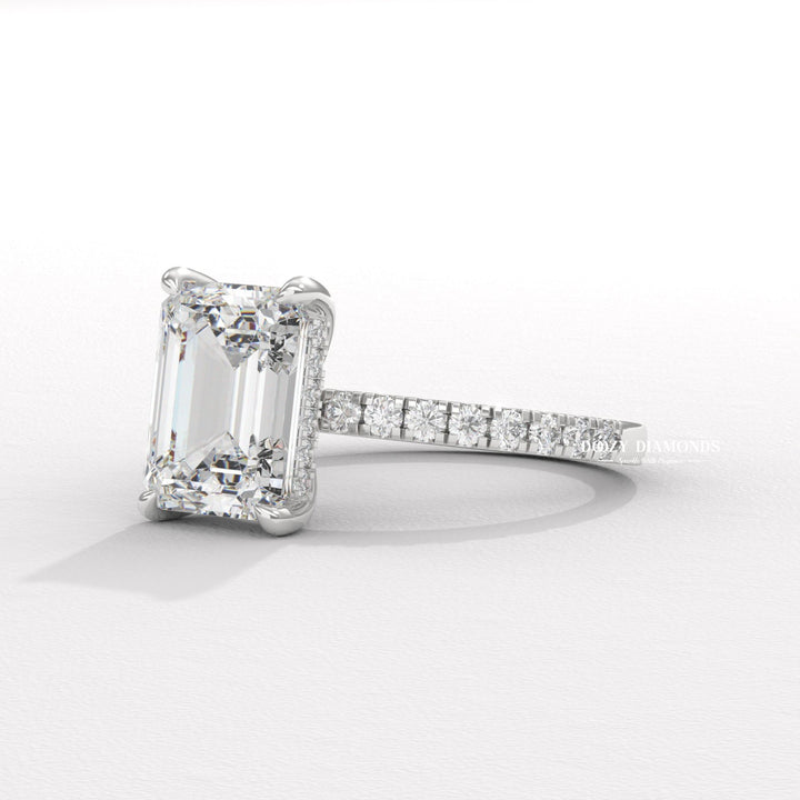 Profile view of emerald cut hidden halo engagement ring band