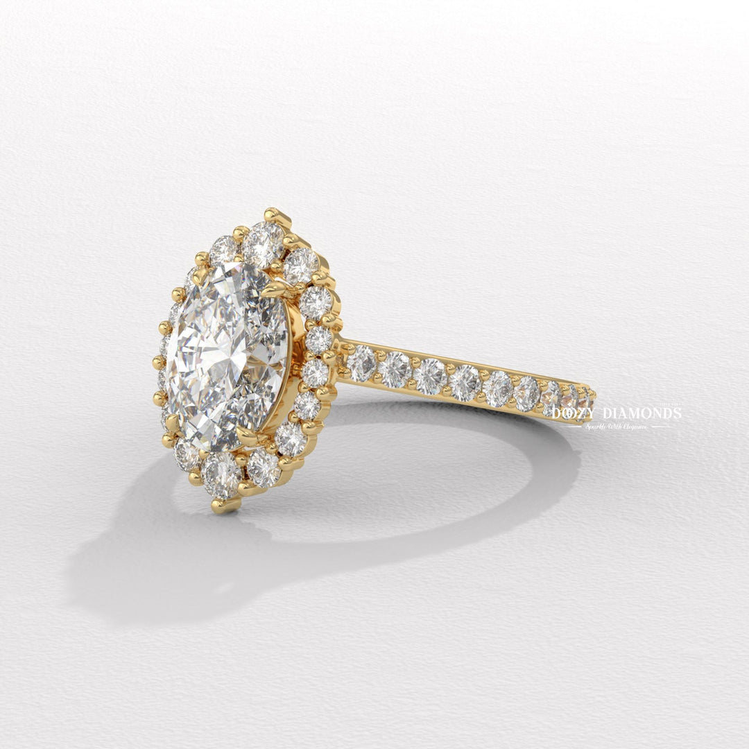 Oval halo engagement ring shown on hand for true-to-life sizing