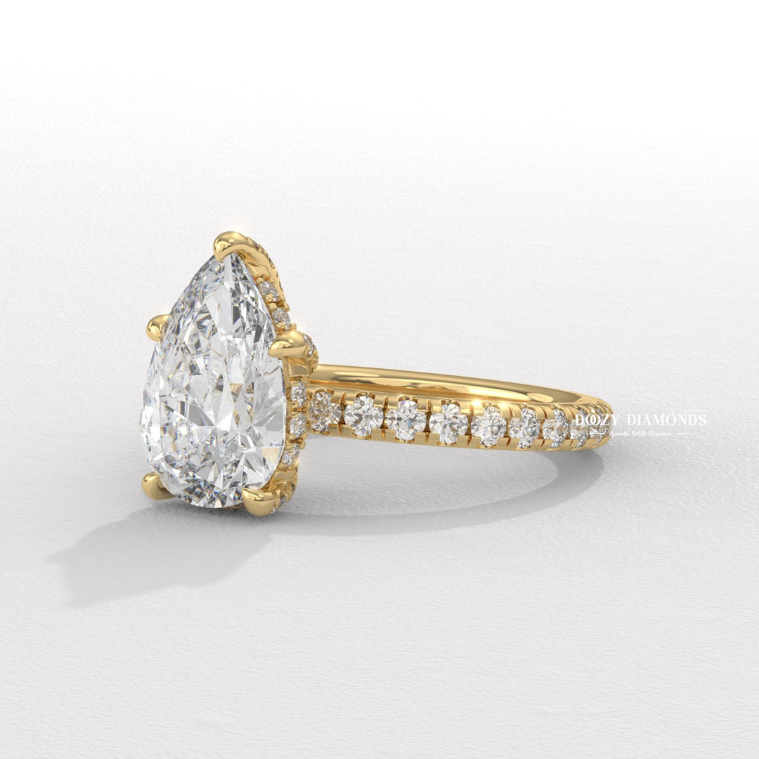 Top-down view of pear cut hidden halo engagement ring