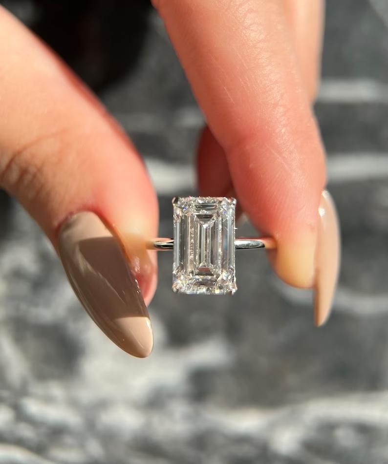 5.0CT emerald cut solitaire engagement ring available to buy now