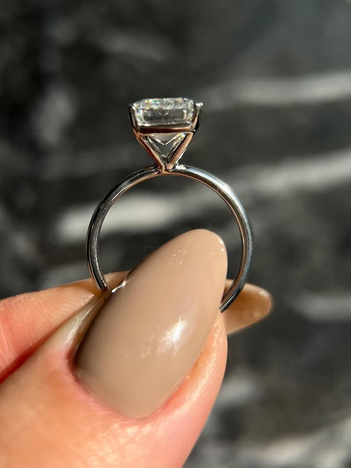 Classic emerald solitaire engagement ring crafted for everyday wear
