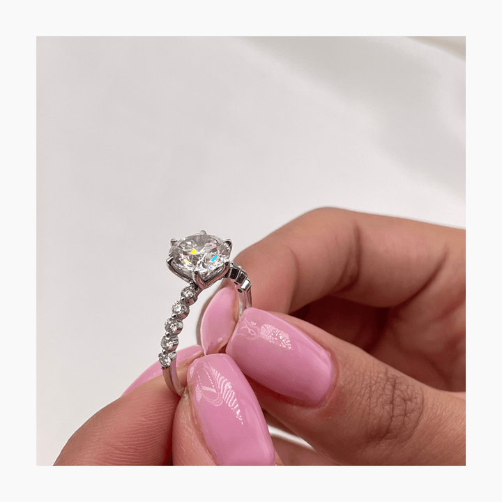 Premium round cut pave engagement ring crafted in solid gold