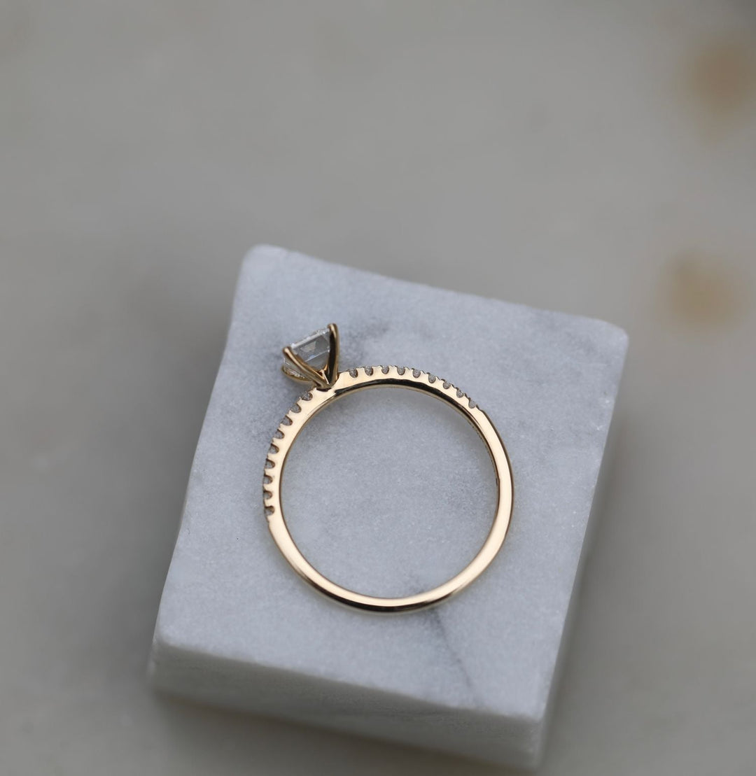 Emerald solitaire diamond ring presented in signature gift packaging