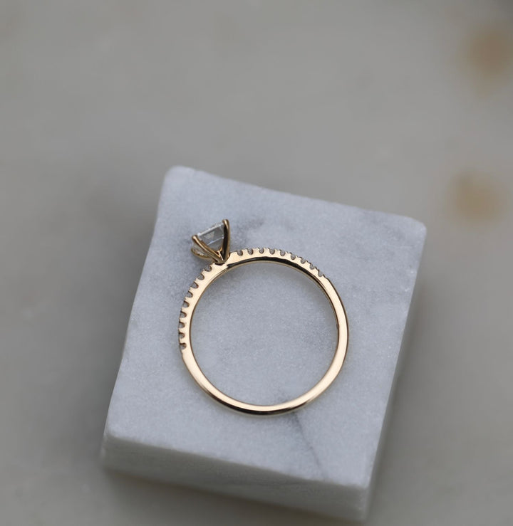 Emerald solitaire diamond ring presented in signature gift packaging