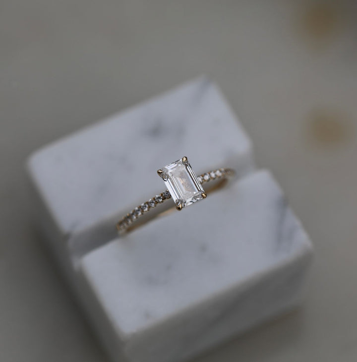 Emerald solitaire engagement ring offered in gold and platinum