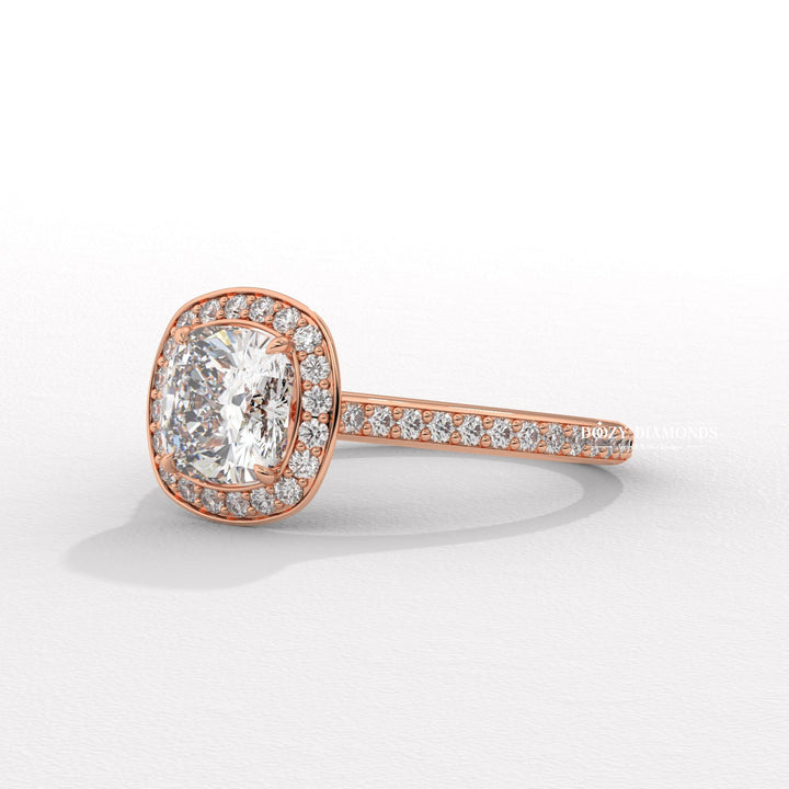 Cushion halo engagement ring shown on hand for true-to-life sizing