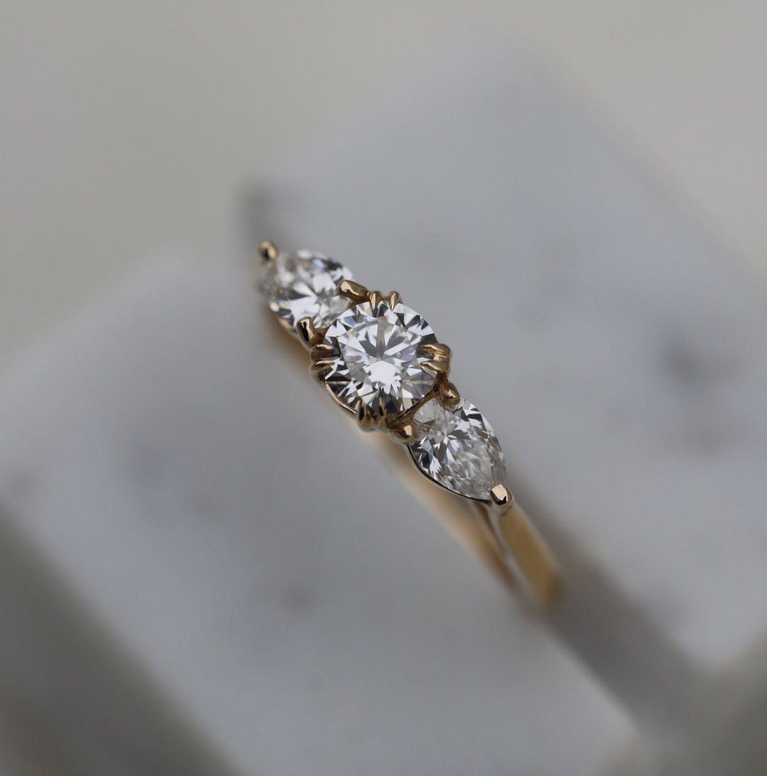 Side angle of round solitaire diamond engagement ring