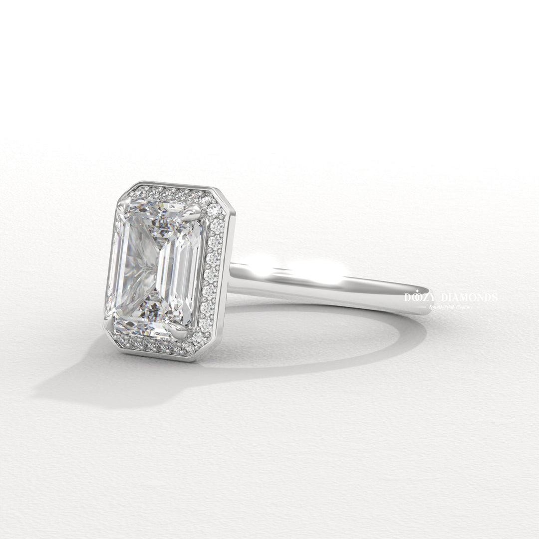 Unboxing view of emerald cut halo diamond engagement ring