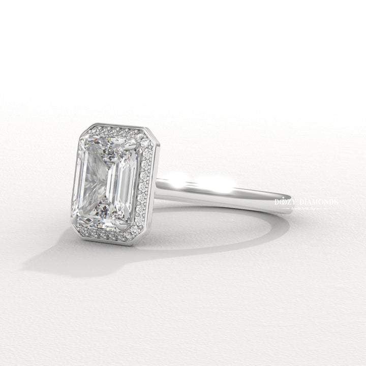 Unboxing view of emerald cut halo diamond engagement ring