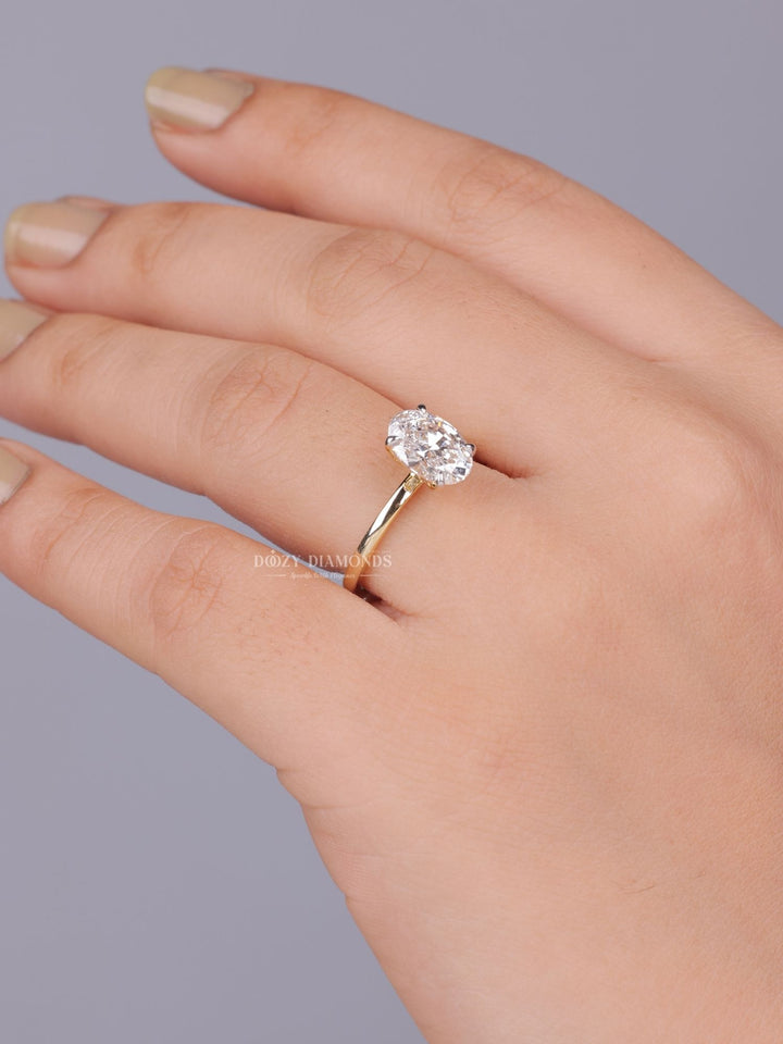 Oval solitaire ring set with an IGI graded diamond